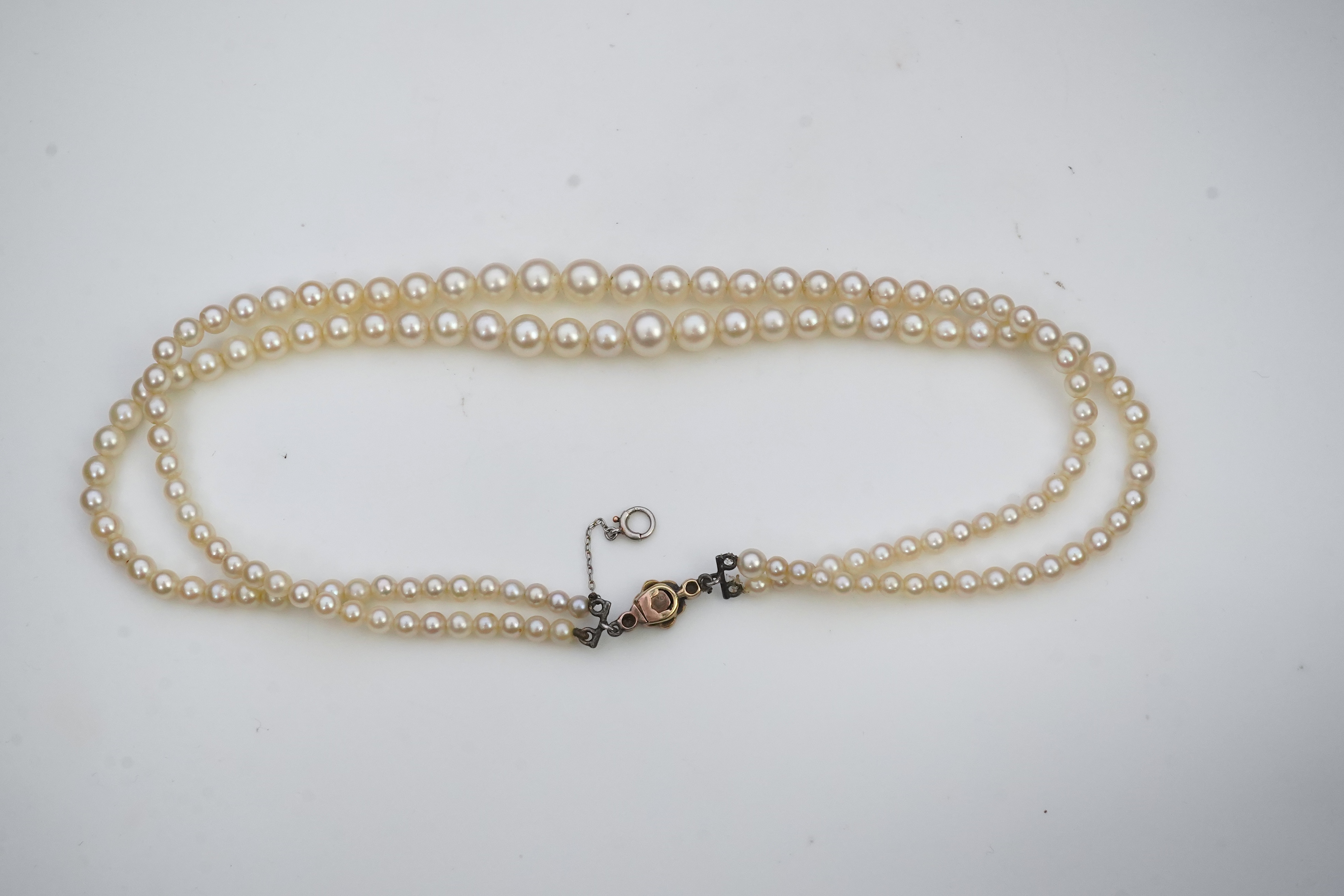 A cultured pearl and diamond necklace, early 20th century and later